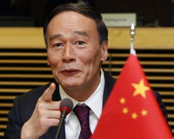 China's Vice Premier Wang Qishan gestures at the start of a meeting with European Union Trade Commissioner Catherine Ashton at the European Commission headquarters in Brussels May 7, 2009. [Agencies]
