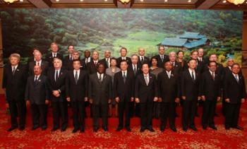 Chinese President Hu Jintao (C front) meets with envoys and delegates of some countries and international organizations, who come to attend the activities marking the anniversary of last year's devastating earthquake in the southwestern Sichuan Province, in Chengdu, capital of Sichuan Province, May 11, 2009. (Xinhua/Ju Peng)