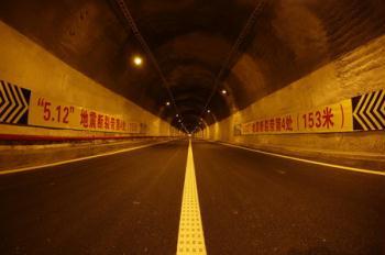 This photo taken on May 11, 2009 shows the inside of a tunnel on Yingxiu-Dujiangyan expressway which connects Yingxiu town and Dujiangyan city, both hard-hit by last year's massive earthquake in southwest China's Sichuan province. [CFP]