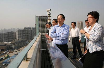 Wang Jianzhou, president of China Mobile, takes a bird's eye view of the Expo site.