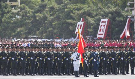 The guard of honor of the three services of the Chinese People's Liberation Army marches at the head of the march-past of a parade in the celebrations for the 60th anniversary of the founding of the People's Republic of China, in central Beijing, capital of China, Oct. 1, 2009.(Xinhua/Liu Dawei)