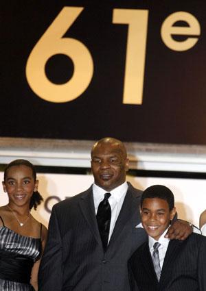 Former world heavyweight champion Mike Tyson (C) arrives with his family for the screening of U.S. director James Toback's documentary film "Tyson" at the 61st Cannes Film Festival May 16, 2008.(Xinhua/Reuters Photo)