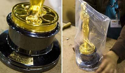 The gold-plated statuette then has its base screwed on before being bagged and put into a foam-fitted box, ready for shipping to Hollywood(Picture: EPA)