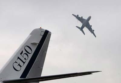 The Airbus A380 (R), the world's largest passenger jet, performs during the 7th China International Aviation and Aerospace Exhibition in Zhuhai, south China's Guangdong Province, Nov. 4, 2008. The six-day exhibition opened on Tuesday with about 600 aviation and aerospace manufacturers from 35 countries and regions attending.(Xinhua