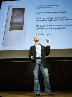 Amazon.com founder and Chief Executive Officer Jeff Bezos holds the new Kindle 2 electronic reader at a news conference in New York where the device was introduced, February 9, 2009. Online retailer Amazon.com Inc unveiled the latest incarnation of its digital book reader, the Kindle, on Monday in a slimmer version with more storage and a feature that reads text aloud to users. (Xinhua/Reuters Photo)