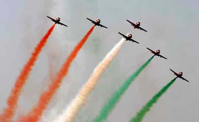 An Indian aerobatics team performs during the opening ceremony of an airshow in Bangalore, India, Feb. 11, 2009. The Aero India 2009 which opened here Wednesday attracted 592 firms from 25 countries and regions. (Xinhua photo)