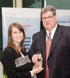 Rick Obenschain (right) presents Stephanie Getty with the prestigious Kerley Award.
