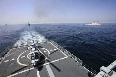 China's navy "Guangzhou" destroyer is seen at the Arabia Sea off the southern Pakistani port of Karachi, on Mar. 9, 2009. Warships from participating countries Monday began their second phase of the two-week-long AMAN 09 military exercises at the Arabia Sea off the southern Pakistani port of Karachi. (Xinhua photo)