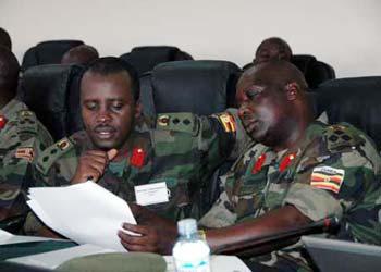 Representatives from Uganda People's Defense Force attend the opening ceremony of the HIV/AIDS Conference for the African Military at Nile Resort Hotel in Jinja, eastern Uganda on March 11, 2009. The three-day conference, organized by the African Union, attracted over 60 participants from 15 African countries. The armies from central, southern, western and central African countries are planning to form a network to fight HIV in the military. (Xinhua Photo)