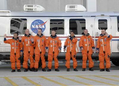 Space shuttle Discovery astronauts (L-R) Koichi Wakata of Japan, John Phillips, Richard Arnold, Steve Swanson, Joseph Acaba, Pilot Tony Antonelli and Mission Commander Lee Archambault leave their crew quarters for launch pad 39A at the Kennedy Space Center in Cape Canaveral, Florida March 15, 2009. (Xinhua Photo)