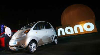 Tata Nano cars are displayed during their launch in Mumbai March 23, 2009. The Nano, the world's cheapest car, will hit Indian roads in July, four months after its formal launch on Monday, and demand is expected to far outstrip supply as the price tag of around $2,000 draws legions of new buyers. (Xinhua/Reuters Photo)