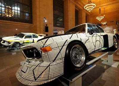 The 1976(R) and 1977 BMW art cars are on display in the Grand Central Terminal in New York, the United States, March 24, 2009. A public BMW art car world tour exhibition kicked off in New York on Tuesday. (Xinhua photo)