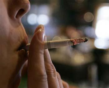 In June 3, 2008 an employee takes a drag on a cigarette at Morgan's Place bar and restaurant in Harrisburg, US.[File photo]