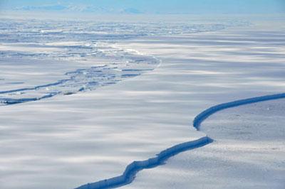 The Wilkins Ice Shelf off the Antarctic Peninsula is seen breaking up January 18, 2009. The huge Antarctic ice shelf is on the brink of collapse with just a sliver of ice holding it in place, the latest victim of global warming that is altering maps of the frozen continent. (Xinhua/Reuters Photo)