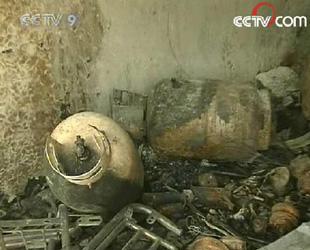 The 2 gas container which was set on fire by the rioters is seen in the aftermath after the fire in a garage in Dagze county. (CCTV.com)