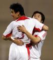 2006年10月11日，中国队球员孙祥（左）进球后与队友庆祝。当日，中国队在约旦阿卜杜拉国王体育场举行的亚洲杯足球预选赛E组比赛中，以2比0击败巴勒斯坦队，获得小组出线。 新华社发